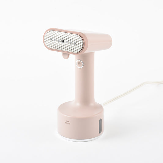 Vaporizador práctico para peinar en rosa y beige